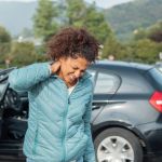 What Are Expert Witnesses And Why Are They Necessary? - Woman feeling neck ache after bad cars pile up