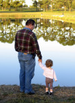 estate planning attorney - Father and daughter looking at beautiful reflective lake