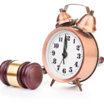 Gavel and old clock