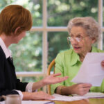 Senior woman meeting with agent