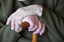 Guardianship-elderly hands on cane