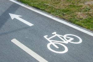 Bicycle Accident Lawyer Nashua, NH - Bike lane sign on asphalt