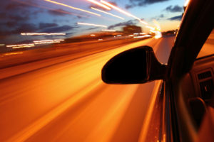 Car Accident Lawyer Nashua, NH - night drive motion blurred transportation background