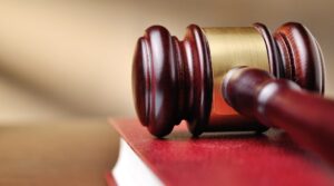 Gavel on top of law book sitting on the desk of a Workers' Compensation Lawyer Nashua, NH