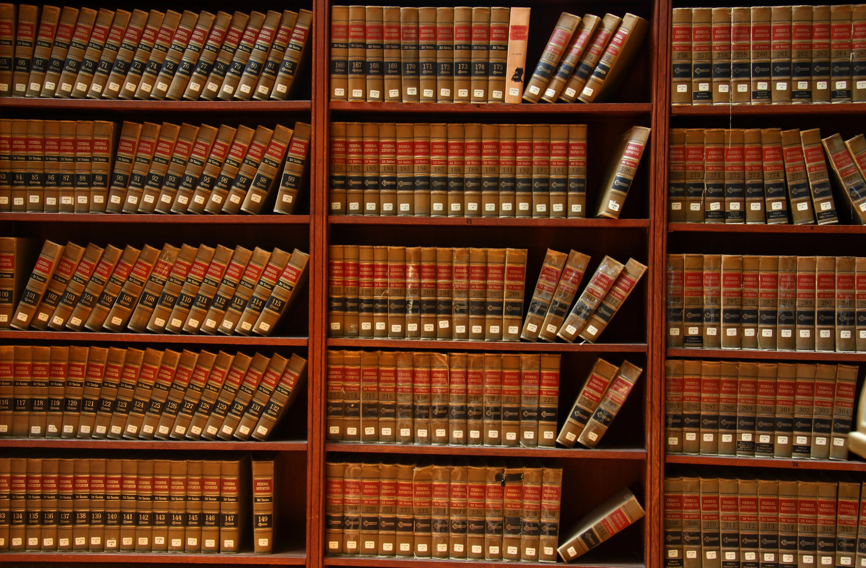 Legal books on the bookshelves of a Manchester, NH personal injury lawyer